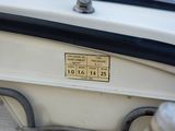 a close up of a boat ' s engine with a label on it