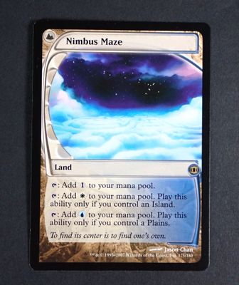a close up of a card on a table with a sky background