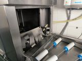 an image of a machine in a kitchen that is making dough