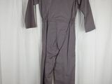 the back view of a gray jumpsuit with a black collar