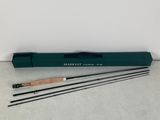 a set of three fly rods with a wooden handle and a green case