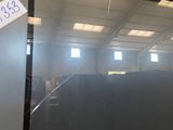 an image of a large television screen in a warehouse