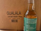 a bottle of gulala next to a cardboard box