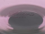 a close up view of a white vase with writing on it