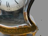 a clock that is sitting on top of a chair