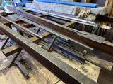 many pieces of metal that are sitting on a table