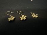 a pair of gold plated earrings and a pair of gold plated earrings