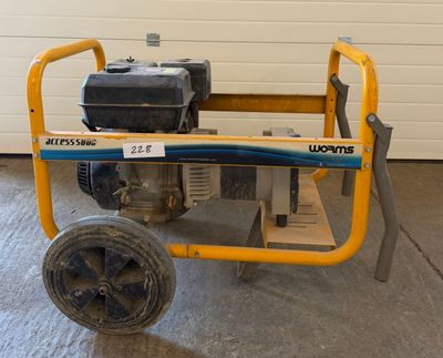 an image of a small generator on wheels in a garage