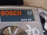 a bosch circular saw sitting on top of a table