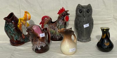 many different vases that are sitting on a table