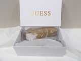 a white box with two cookies in it on a table