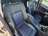 the interior of a car with black leather seats and a black steering wheel