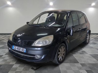 a picture of a small black car parked in a garage
