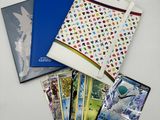 a lot of cards and a book on the table