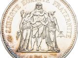 a close up of a coin on a white background