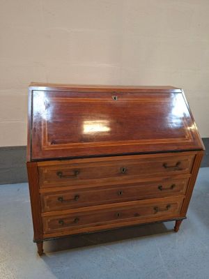 a small wooden desk with a drawer on it