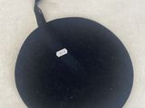 a black hat with a white tag on it