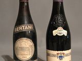 two bottles of wine sitting next to each other on a table