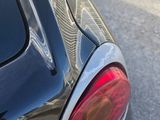 a close up of a car ' s tail light on the street