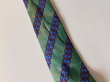 a close up of a tie on a white table