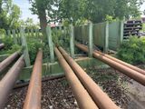 a lot of pipes that are sitting in the dirt