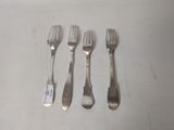 four forks and a knife are lined up on a table