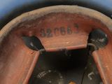 a close up view of a rusted tire with the number 3 on it
