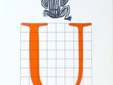 un dessin représentant une grenouille assise sur la lettre « u »