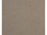 a brown piece of paper with a sticker on it