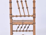 a wooden chair with a woven seat on a white background