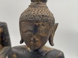 statue of a person sitting in a lotus position on a white background