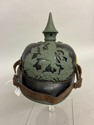 a helmet with a green decoration on the top of it