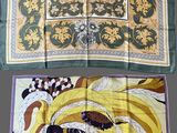 three different types of silk scarves are displayed on a gray surface