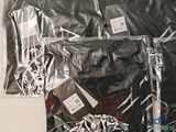 a pile of clothes wrapped in plastic on a table
