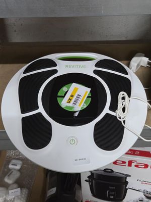 a black and white object on a table next to a box