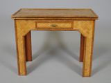 a small wooden table with a drawer on top of it