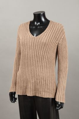 a woman ' s sweater with a v - neck and long sleeves on a mannequin mannequin mannequin mannequin mannequin manne