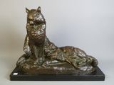 bronze statue of a cat and a dog on a black base