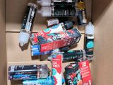 a box full of toothbrushes, toothpaste, toothpaste, toothpaste, toothpaste, toothpaste, toothpas