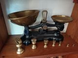 a scale that is sitting on a shelf in a room