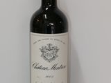 a bottle of wine that is sitting on a table