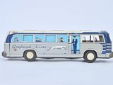 a toy bus that is sitting on a white surface