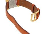 an image of a watch with a brown leather strap and a gold buckle