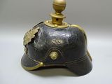 a black helmet with a gold decoration on it