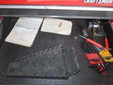 a tool box with tools in it that is sitting on the floor