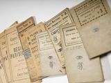 a lot of old papers that are on a table