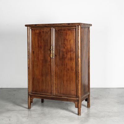 a wooden cabinet with two doors and two drawers