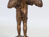 bronze statue of an angel with a bow and arrow on a pedestal