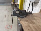 an image of a vise on a workbench in a workshop