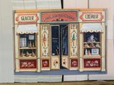 a painting of a store front on the wall